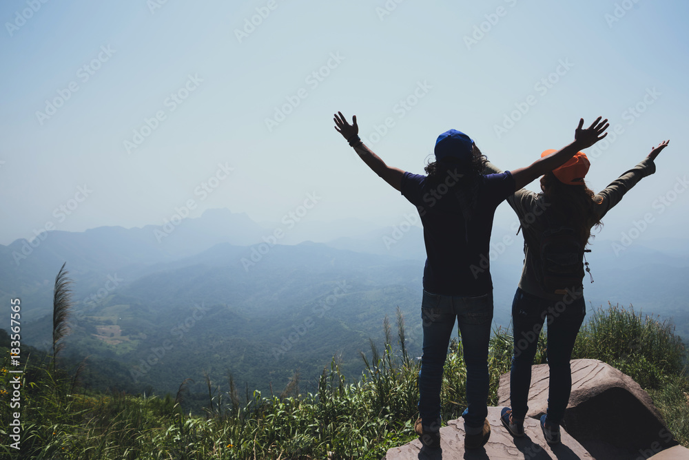 Lover women and men asians travel relax in the holiday. Stand up landscape on the Moutain. Mountain Park happily. In Thailand Lover women and men asians travel relax in the holiday. Stand up landscape on the Moutain. Mountain Park happily. In Thailand
