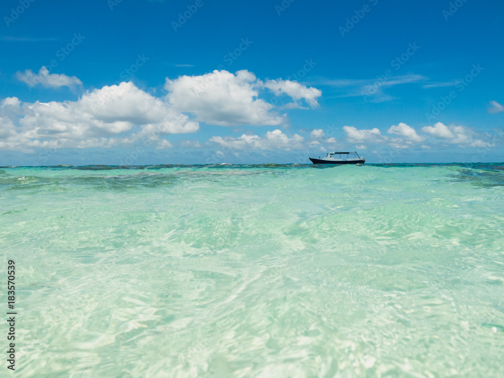 Boat anchored on shallow water Boat anchored on shallow water