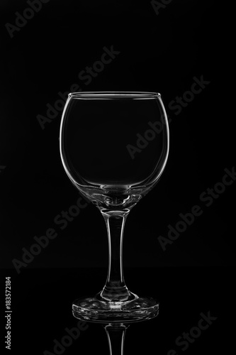 Empty wine glass on black background