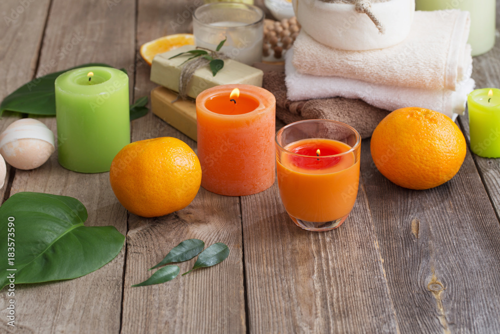 spa concept with orange fruits on old wooden background