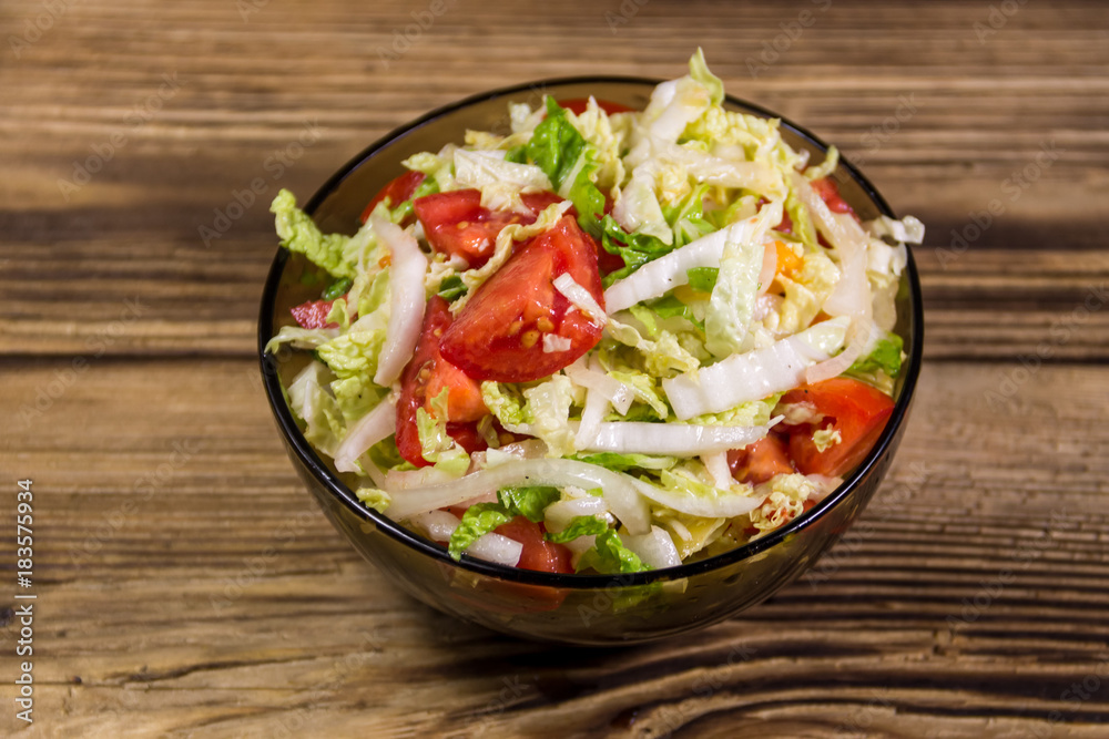 Fresh vegetable salad on wooden table Fresh vegetable salad on wooden table