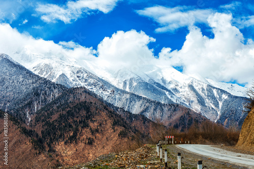 Panoramic view on snow winter spring mountains and cloud sky. Caucasus Mountains. Svaneti region of Georgia.