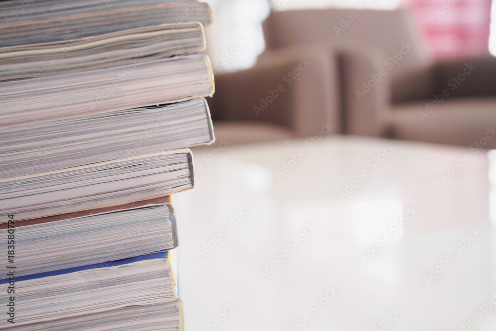 Fototapeta premium pile of magazines stack on white table in living room