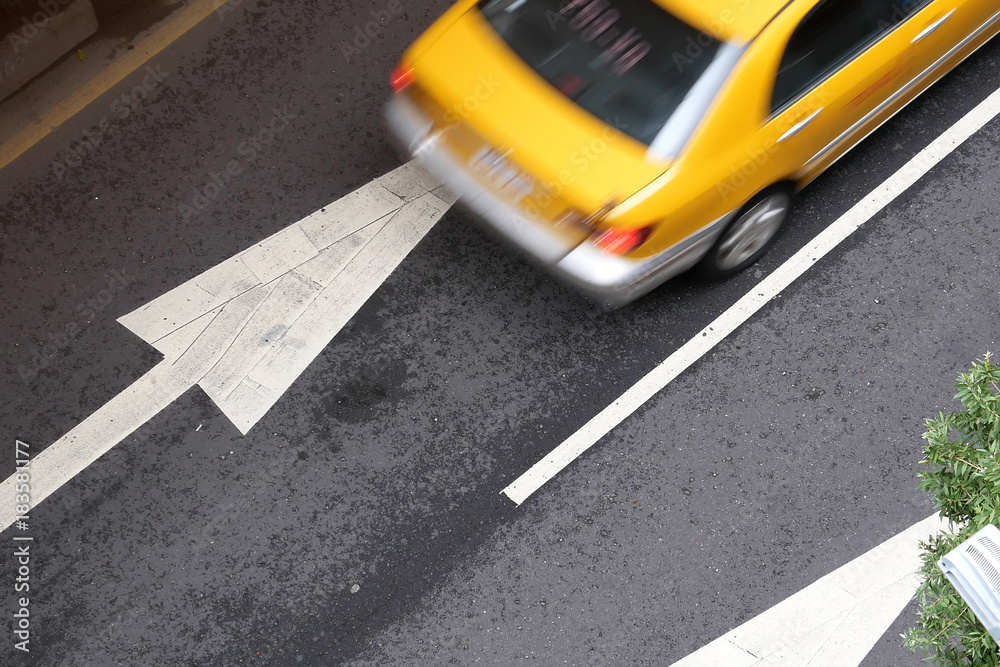 Fototapeta premium Top shot of blur motion taxi on road during rush hour