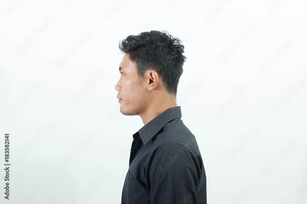 Asian man standing facing side isolated on white background Asian man standing facing side isolated on white background