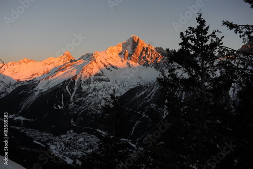 French Alps during sunset with a village in the valley