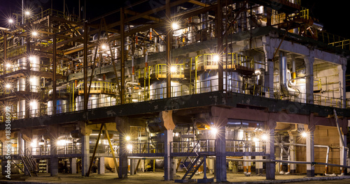 one building at  chemical plant with night illumination