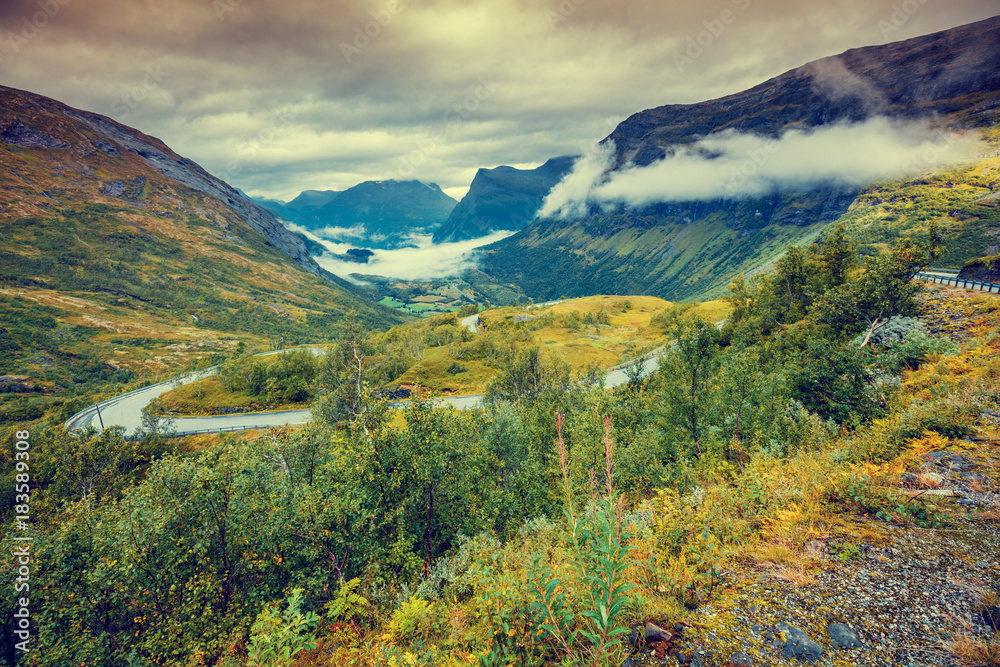 Mountain misty autumn landscape with cloudy sky Norway