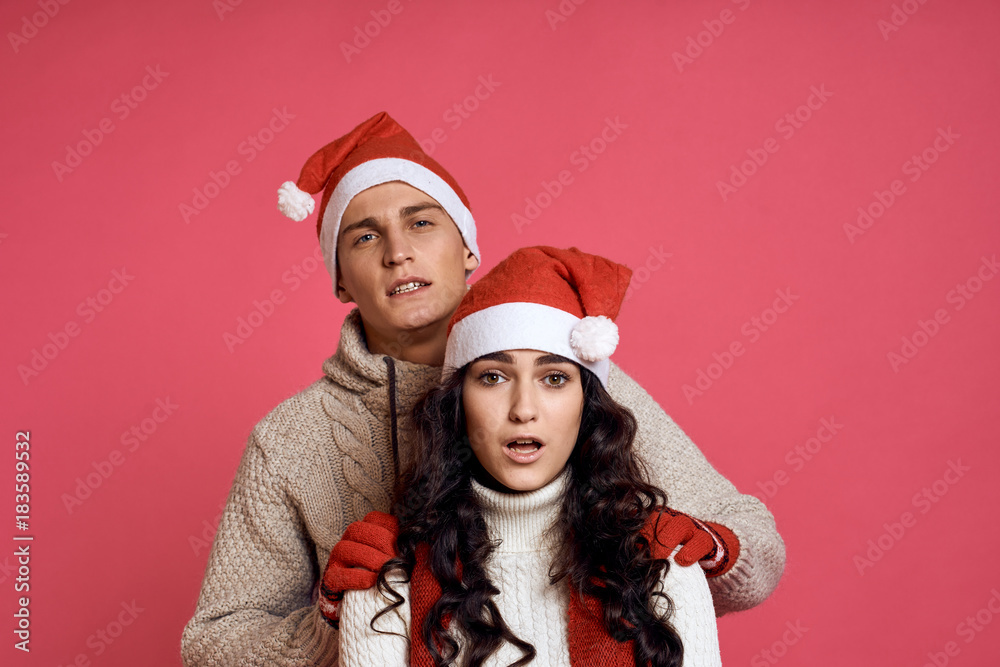 man hugs a woman by the shoulders from behind, a couple, a new year man hugs a woman by the shoulders from behind, a couple, a new year