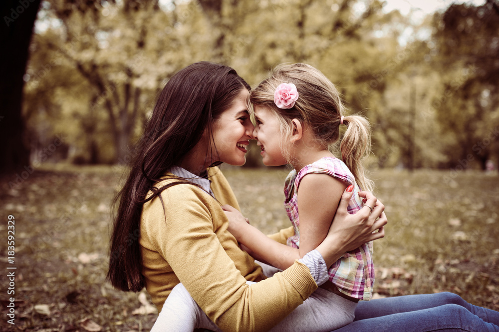 Fototapeta premium Mother and daughter enjoying outdoor.