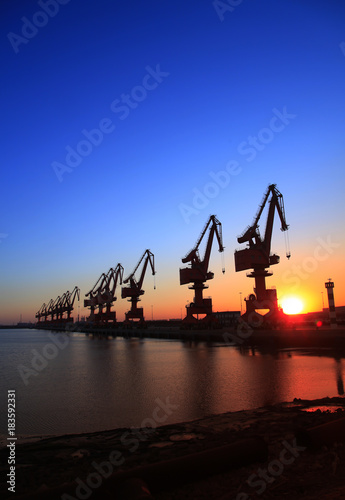 Wharf portal crane in the evening