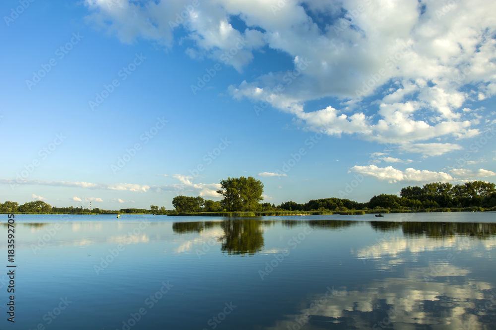 Reflection of white clouds in the lake