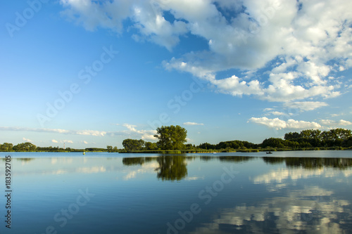 Fototapeta Naklejka Na Ścianę i Meble -  Reflection of white clouds in the lake