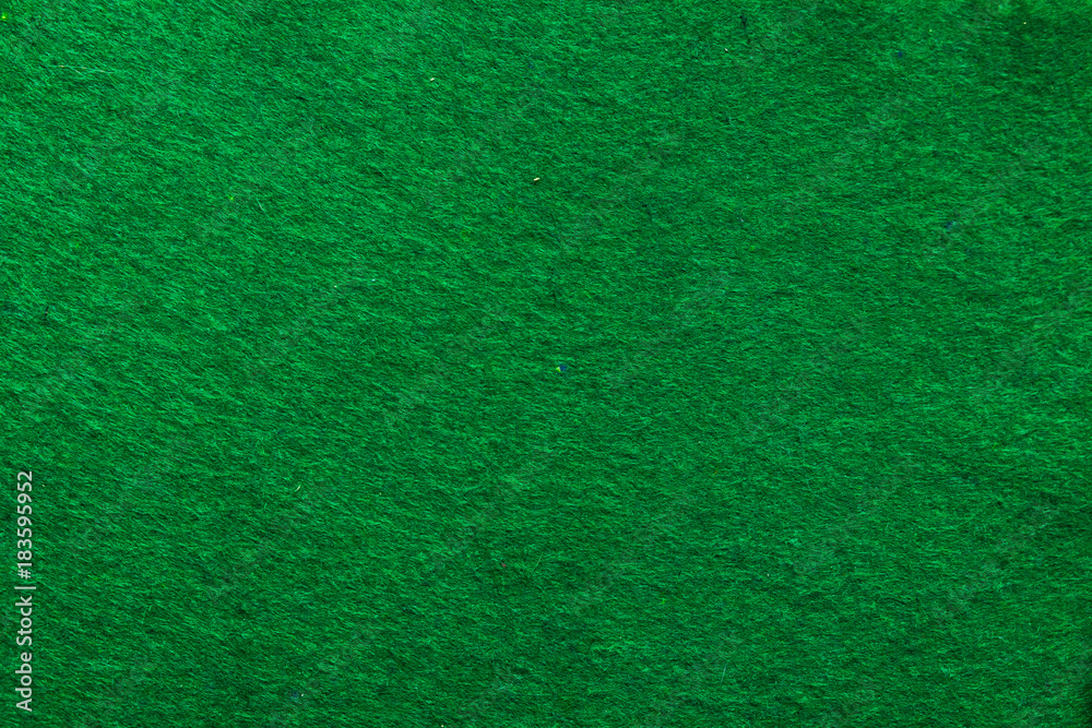 Fototapeta premium The green background on the poker table in the casino