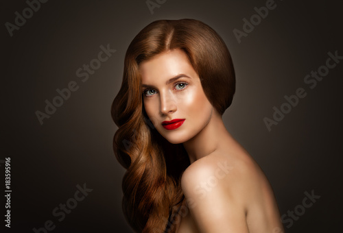 Glamorous Redhead Woman with Perfect Red Wavy Hair on Banner Background with Copy space