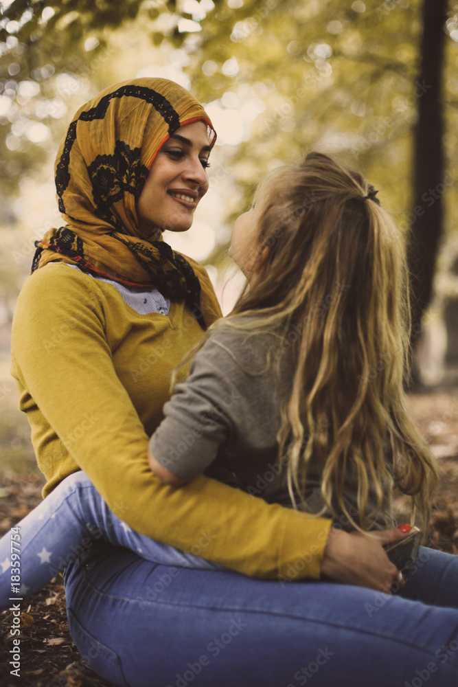 Muslim Mother share love with daughter. Eyes to eyes. Muslim Mother share love with daughter. Eyes to eyes.