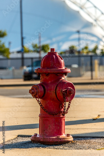 Fotografie A red fire hydrant on a sidewalk in Boston Massachusetts USA in a city setting