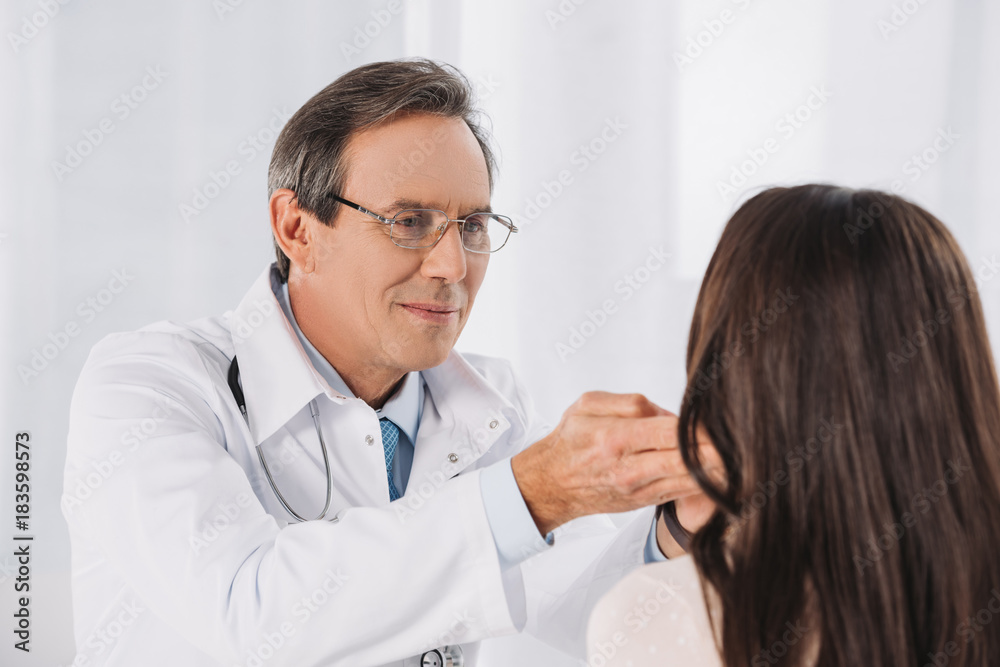 doctor palpating female patient lymph nodes doctor palpating female patient lymph nodes