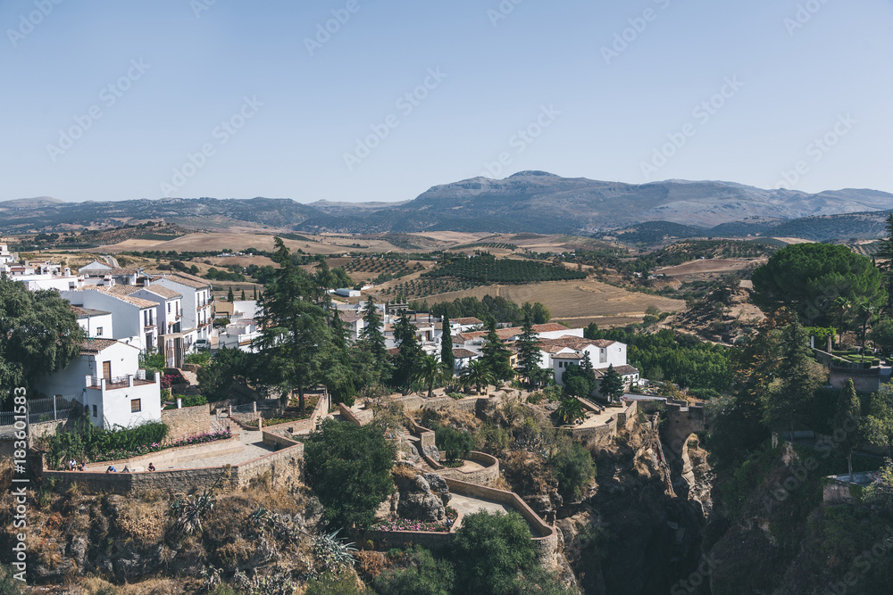 scenic view of spanish landscape with hills, mountains and buildings
