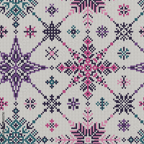 Seamless knitted pattern of colored snowflakes