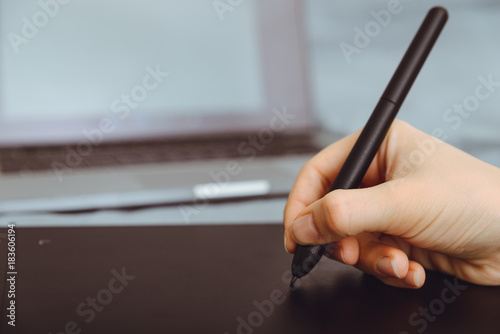 Graphic Tablet Being Used with a Pen by Female Hand