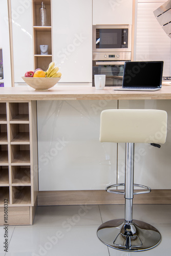 cozy modern dinning room interior with laptop photo