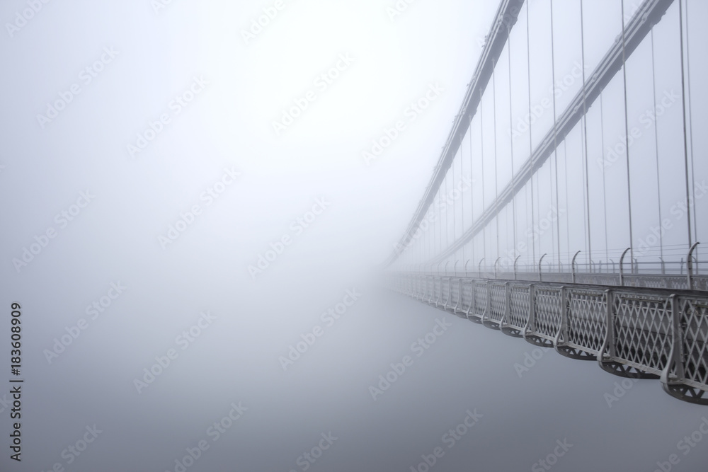 Clifton Suspension Bridge in the fog from the side - obrazy, fototapety, plakaty 