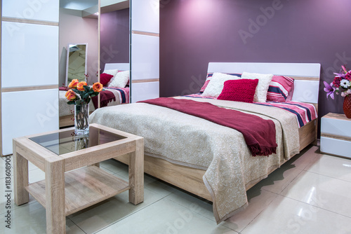 cozy modern bedroom interior in purple tones photo