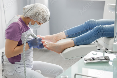 Podiatry doctor. Treatment of feet and nails. photo
