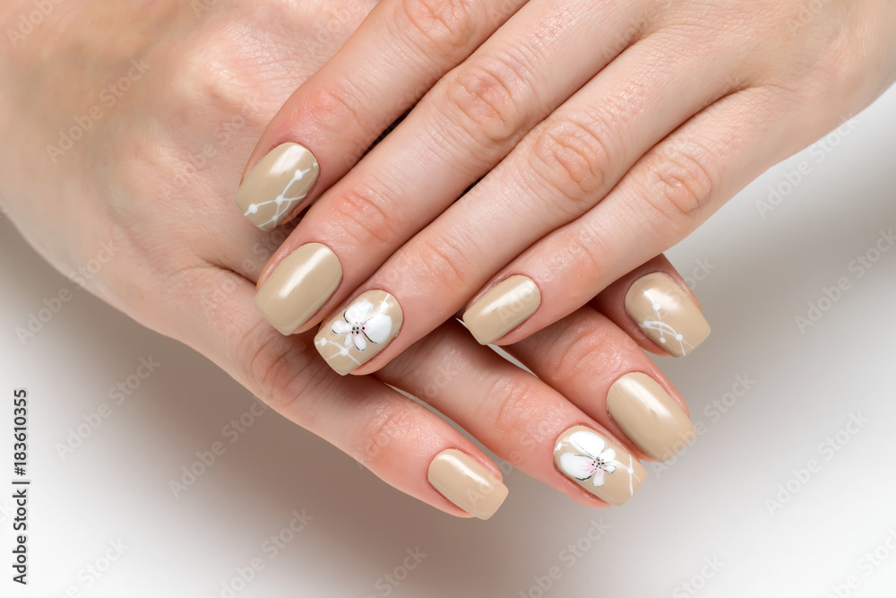 cream, beige manicure on square short nails with painted white orchids on a  white background Stock Photo | Adobe Stock