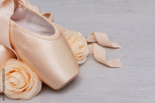 Ballet point shoes on wooden background