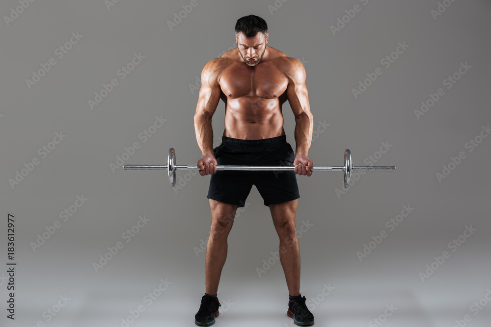 Full length portrait of a confident strong shirtless male bodybuilder Full length portrait of a confident strong shirtless male bodybuilder