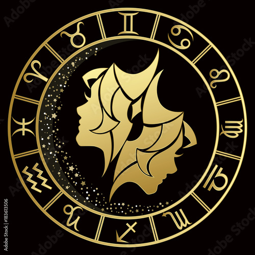 Gemini zodiac sign on a dark background with round gold frame