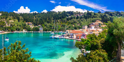 Picturesque fishing village Lakka in Paxos with turquoise sea, Ionian islands of Greece photo