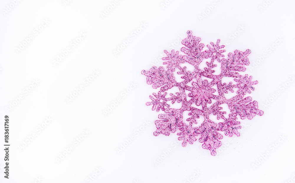Shiny pink snowflake on white background. Decoration for Christmas tree. Copy space Shiny pink snowflake on white background. Decoration for Christmas tree. Copy space