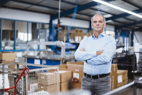 Portrait of business founder in his company