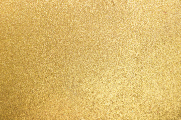Closed up of metallic gold glitter textured background