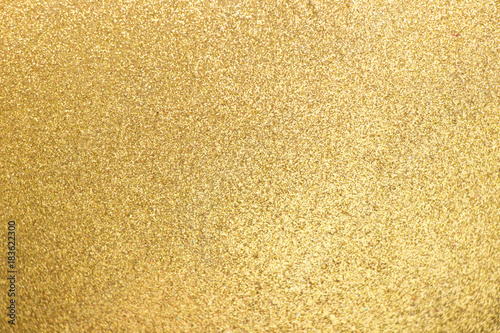 Closed up of metallic gold glitter textured background