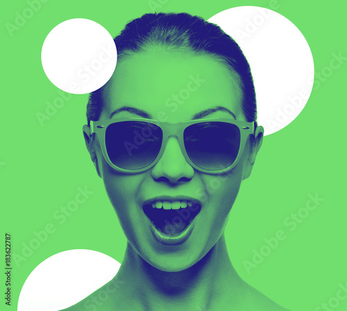happy amazed teenage girl in sunglasses photo