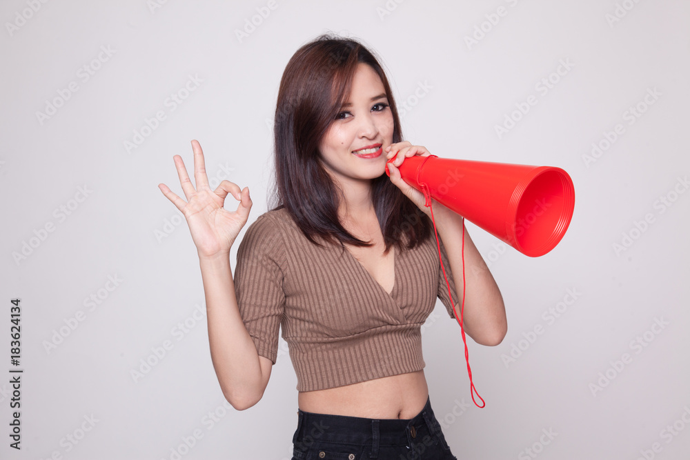 Beautiful young Asian woman show OK announce with megaphone. Beautiful young Asian woman show OK announce with megaphone.