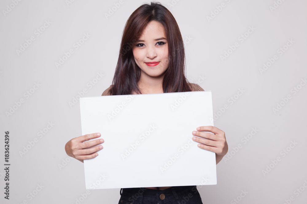 Young Asian woman with white blank sign.