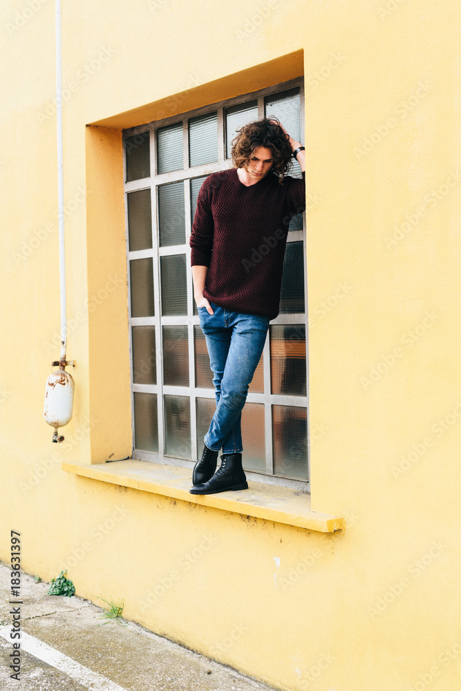 Cool man standing in front of a window Cool man standing in front of a window