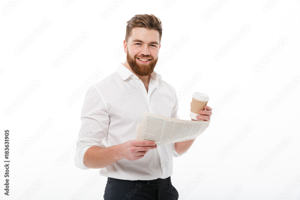 Smiling bearded man in business clothes holding newspaper Smiling bearded man in business clothes holding newspaper
