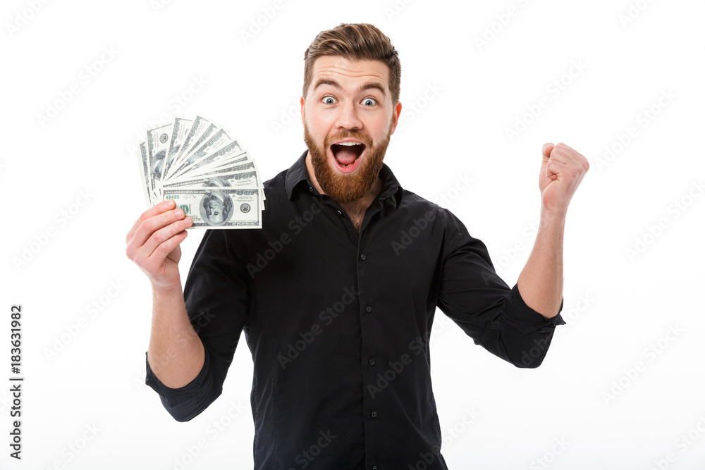 Cheerful bearded business man in shirt holding money Cheerful bearded business man in shirt holding money
