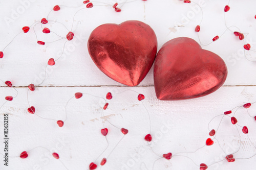 Red big hearts with little hearts in a white background