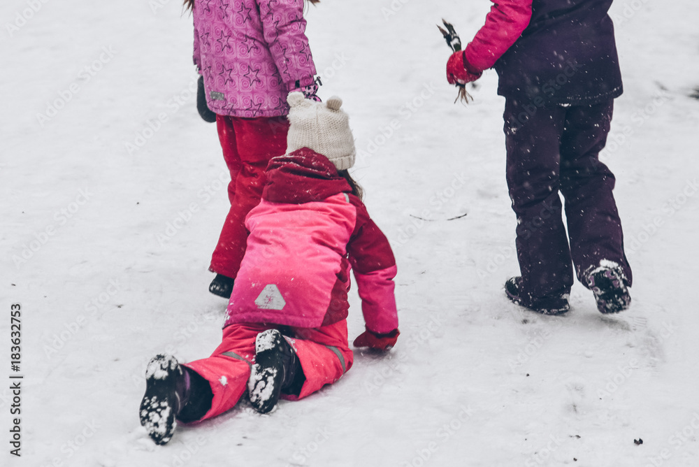 group of kids playing outside in winter day group of kids playing outside in winter day
