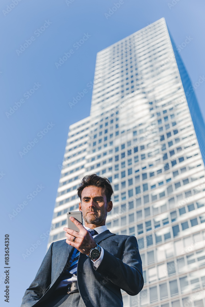 portrait of a businessman who handles a cellphone portrait of a businessman who handles a cellphone
