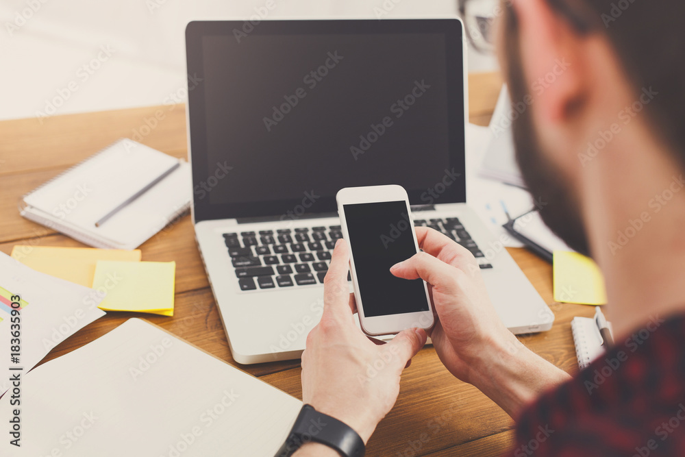 Young casual businessman in office, closeup Young casual businessman in office, closeup