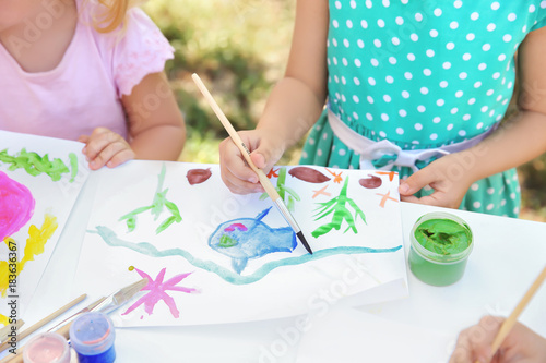 Children painting outdoors