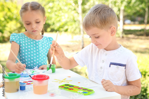 Children painting outdoors